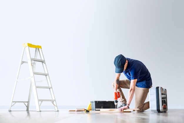 Man renovating his house with design space Free Photo